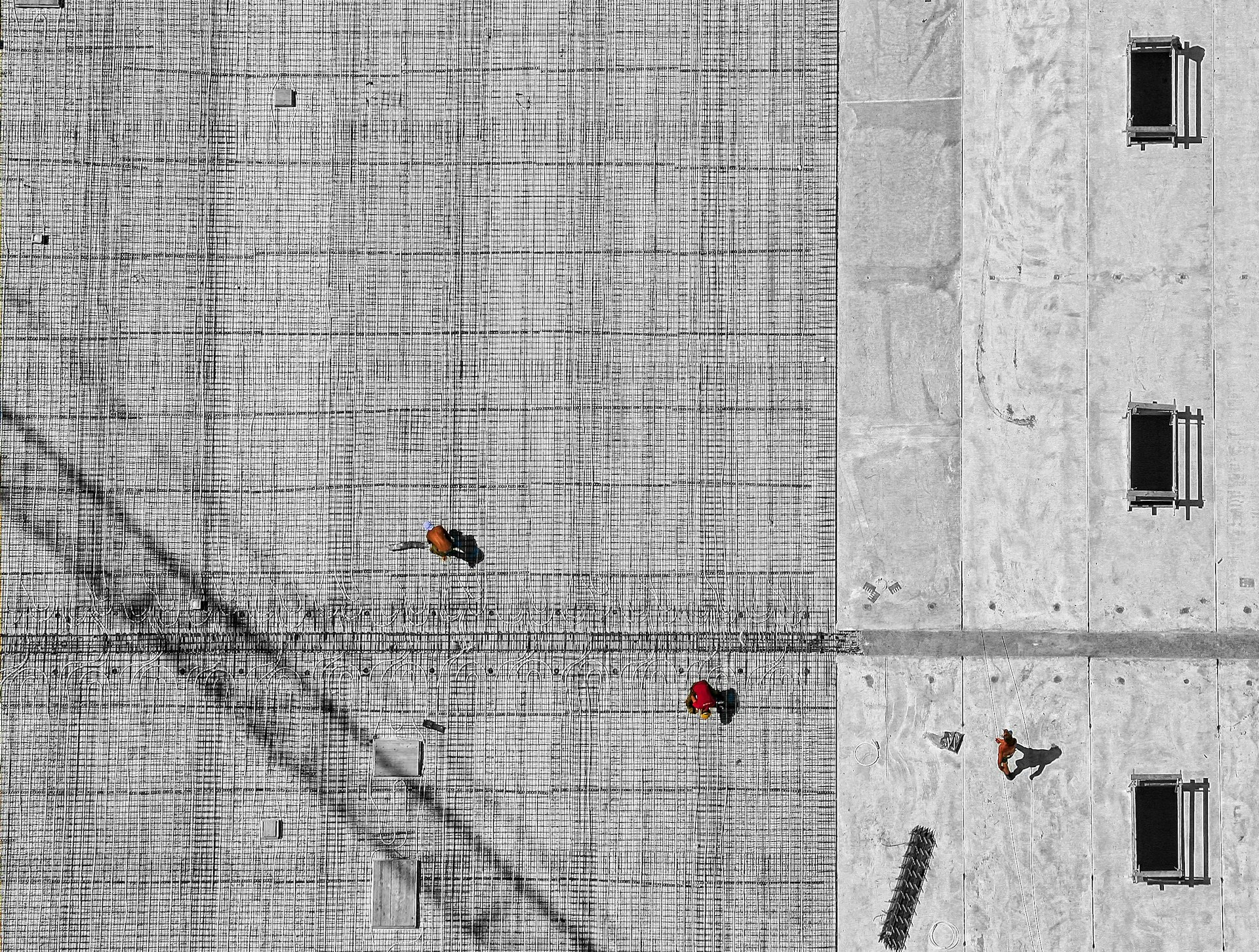 aerial photo of three person walking on floor at daytime